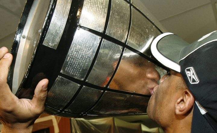 Saskatchewan Rough Riders wide receiver Matt Dominguez kisses the Grey Cup after beating the Winnipeg Blue Bombers 23-19 to win the 95th Canadian Football League Grey Cup in Toronto Sunday, Nov. 25, 2007.