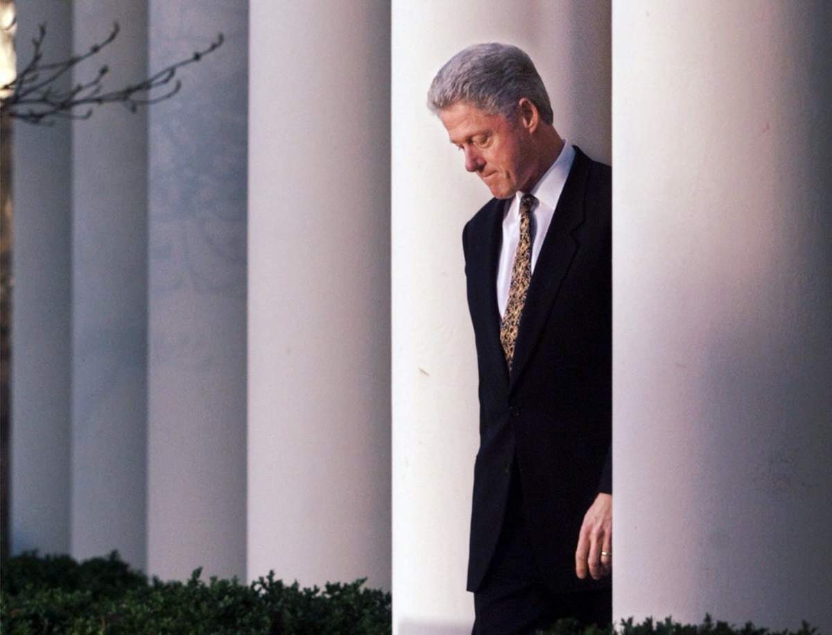 President Clinton walks to the podium to deliver a short statement on the impeachment inquiry in the Rose Garden of the White House in Washington Friday, Dec. 11, 1998.  (AP Photo/J. Scott Applewhite)