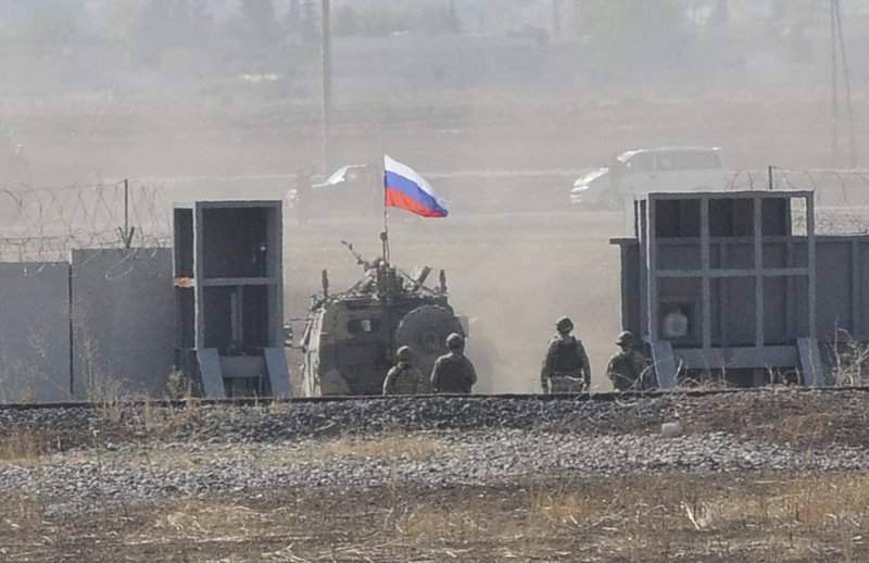 In this photo taken from the outskirts of Suruc, southeastern Turkey, AaRussian army vehicle enters Syria, as it begins its joint patrol with Turkish forces, Tuesday, Nov. 5, 2019. Turkey and Russia launched joint patrols for the second time in northeastern Syria, under a deal that halted a Turkish offensive against Syrian Kurdish fighters who were forced to withdraw from the border area following Ankara's incursion. 