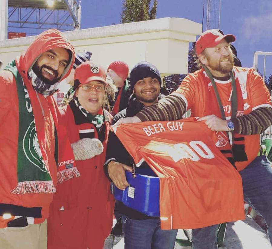 Members of the Foot Soldiers present the personalized jersey.