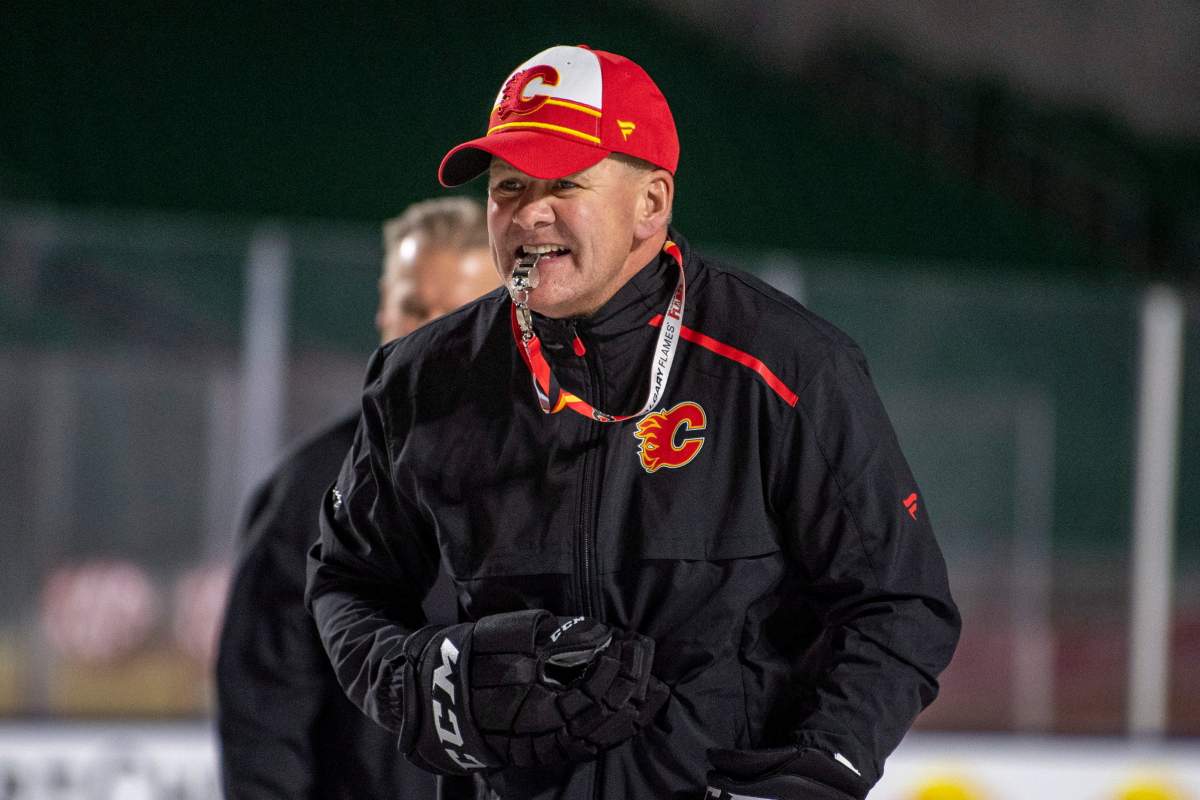 Calgary Flames head coach Bill Peters is under investigation by the team following an accusation that he directed racial slurs toward a Nigerian-born hockey player a decade ago in the minor leagues, then arranged for the players demotion when he complained.
