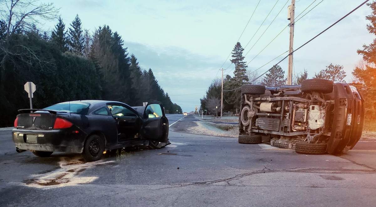 Ottawa police say one driver has been charged with disobeying a stop sign after a two-vehicle collision left a pickup truck flipped over in an intersection in Ottawa's south end on Monday morning.
