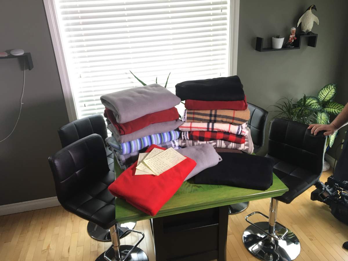 Stacks of handmade blankets.