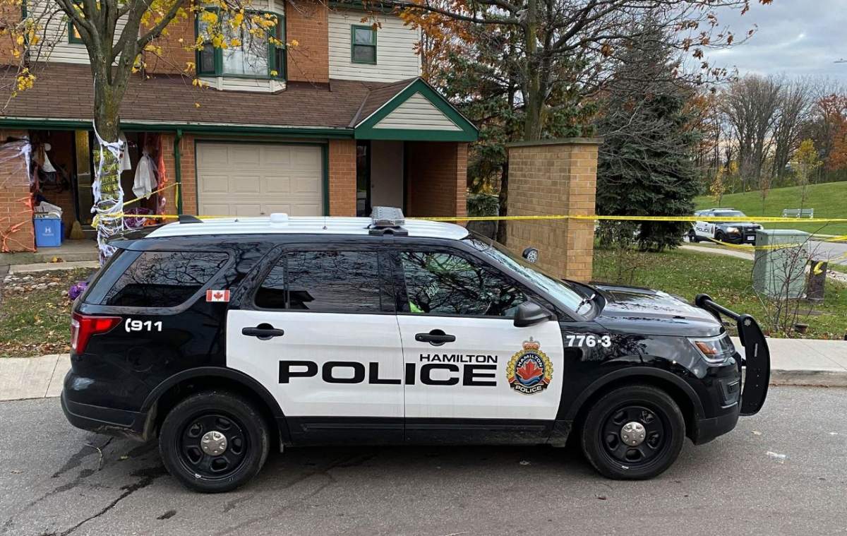 Hamilton police guard a townhouse on Towercrest Drive.