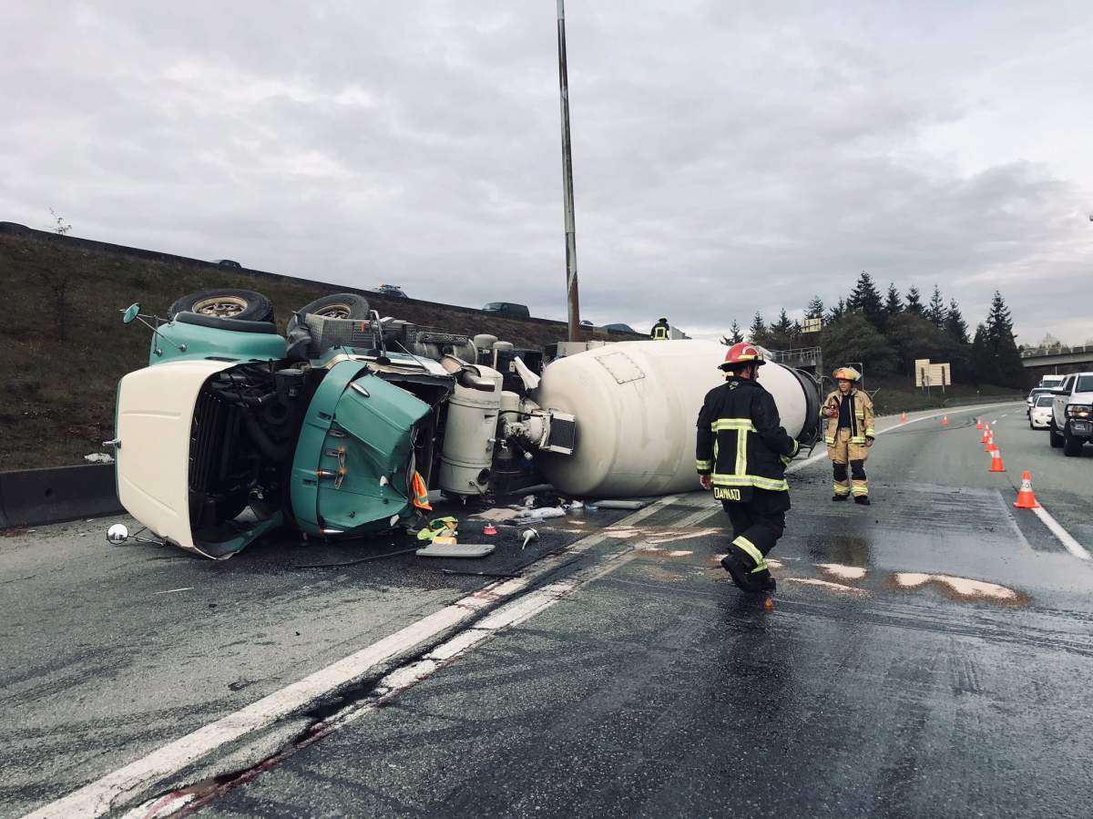 Vancouver fire crews respond to a cement truck crash on the McGill Street on-ramp to Highway 1 in Vancouver on Nov. 7, 2019.