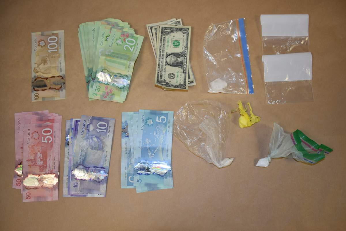 Currency and drugs seized at a Hibernia Street residence in Cobourg on Friday.