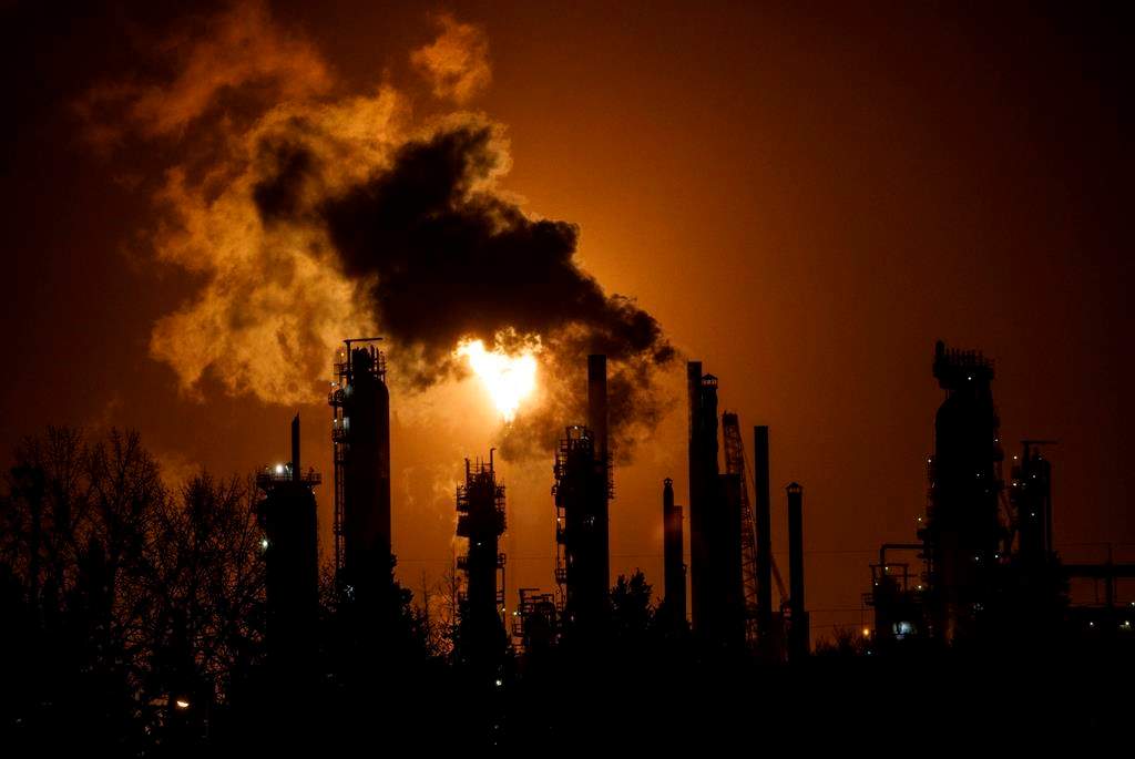 A flare stack lights the sky from the Imperial Oil refinery in Edmonton on Friday, December 28, 2018.