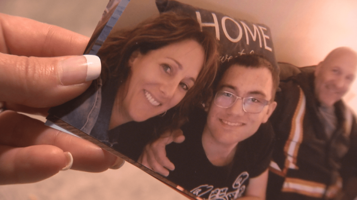 DesRoches holds a photo of her son, Ryan