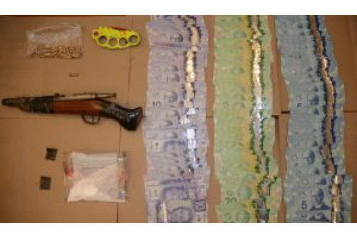 According to police, a loaded .22-calibre sawed-off rifle was recovered, along with cash and drugs.
