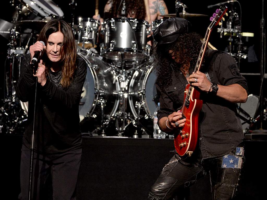 (L-R) Ozzy Osbourne and Slash perform onstage at the 10th annual MusiCares MAP Fund Benefit Concert to raise funds for MusiCares’ addiction recovery resources at Club Nokia on May 12, 2014 in Los Angeles, Calif.
