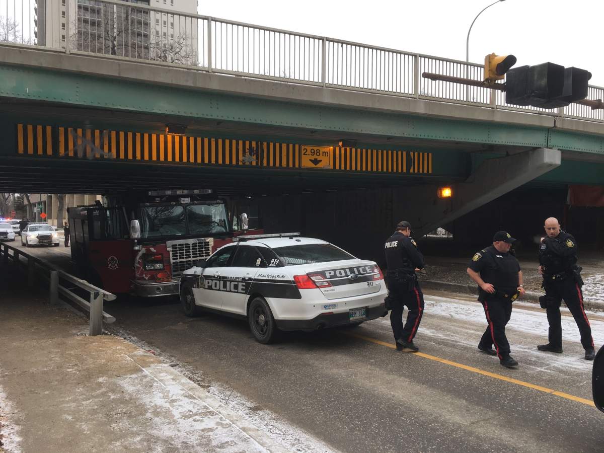 Police at the scene under the Donald Street Bridge.