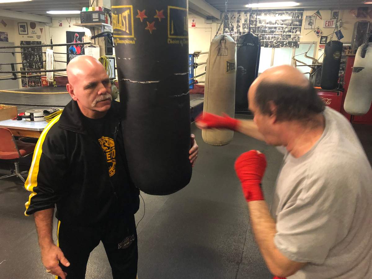 Olympian Johnny Kalbhenn is one of many volunteers who pitch-in at the boxing club which started it all nearly 50 years ago.