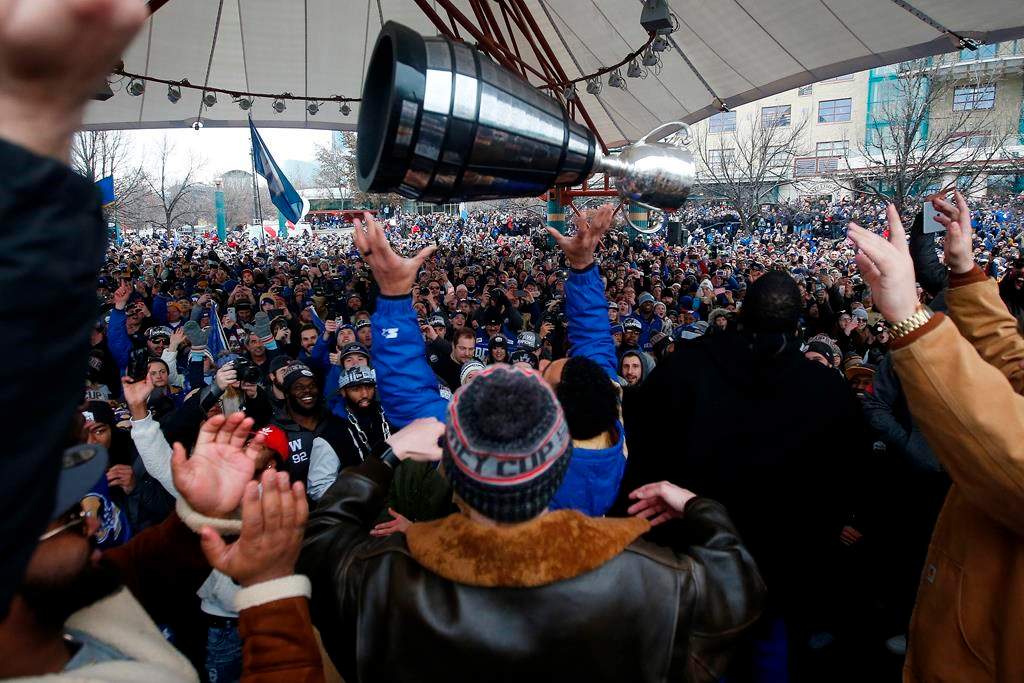 Winnipeggers crowd the downtown streets Tuesday, Nov. 26, 2019, to celebrate as Andrew Harris raises the cup to the end of a Grey Cup drought that lasted almost three decades.