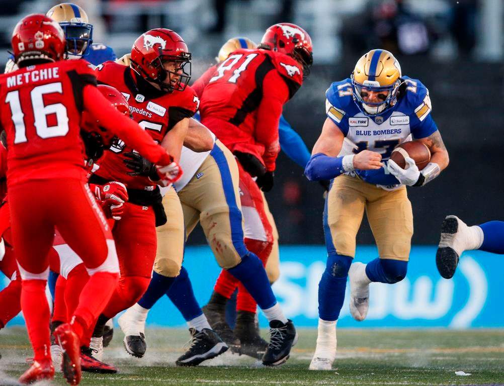 Winnipeg Blue Bombers quarterback Chris Streveler, right, runs the ball during CFL West Semifinal football action against the Calgary Stampeders, in Calgary, Sunday, Nov. 10, 2019.