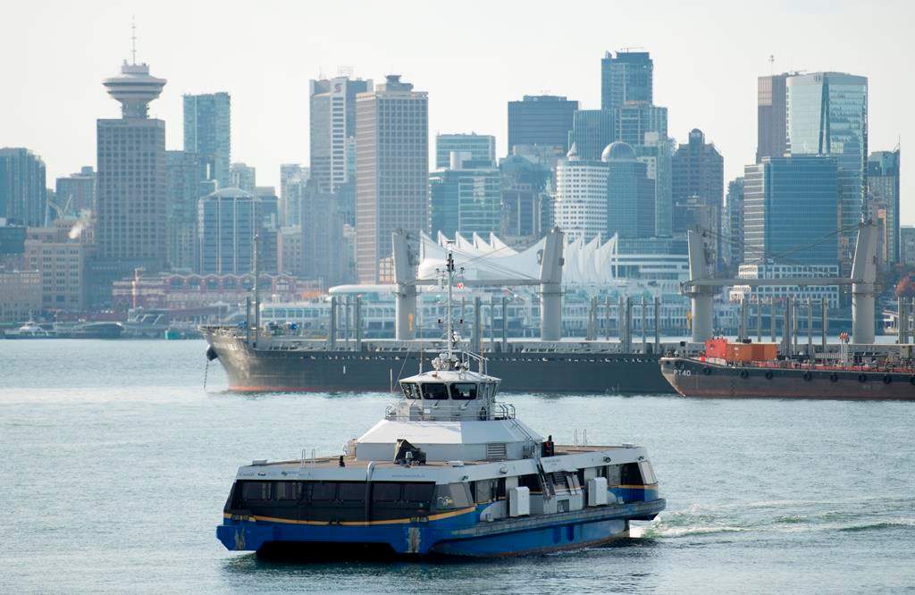 A SeaBus is pictured as it crosses Vancouver harbour with downtown Vancouver pictured in the background Wednesday, Oct., 30, 2019.