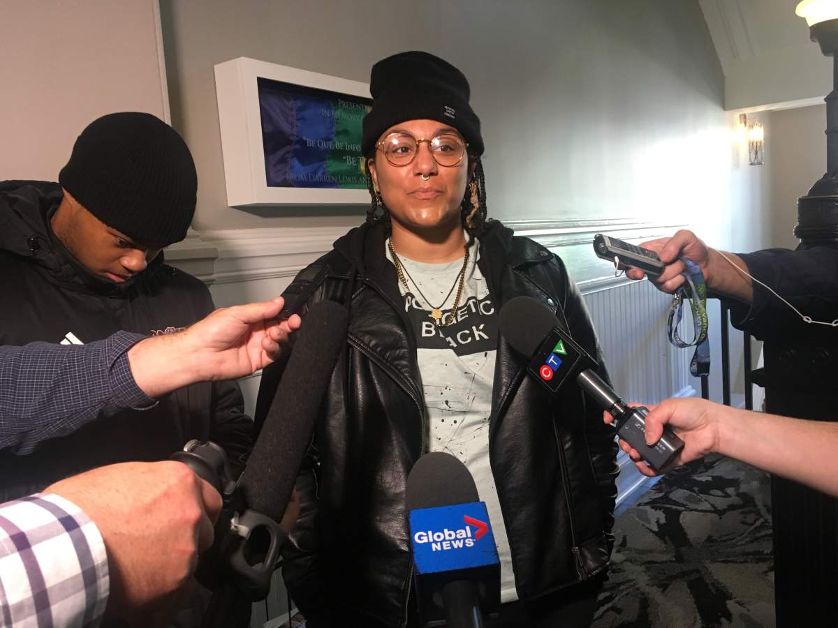 Community advocates Kate Macdonald and Trayvone Clayton speak with reporters outside a Halifax Board of Police Commissioners meeting on Oct. 21, 2019.