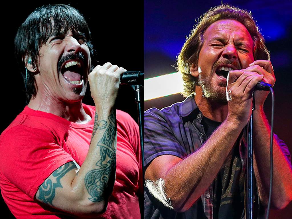 (L-R) Anthony Kiedis of Red Hot Chili Peppers and Eddie Vedder of Pearl Jam, perform live onstage.