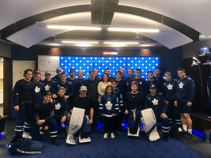 Kade Foster and his family are pictured with the Leafs on Saturday.