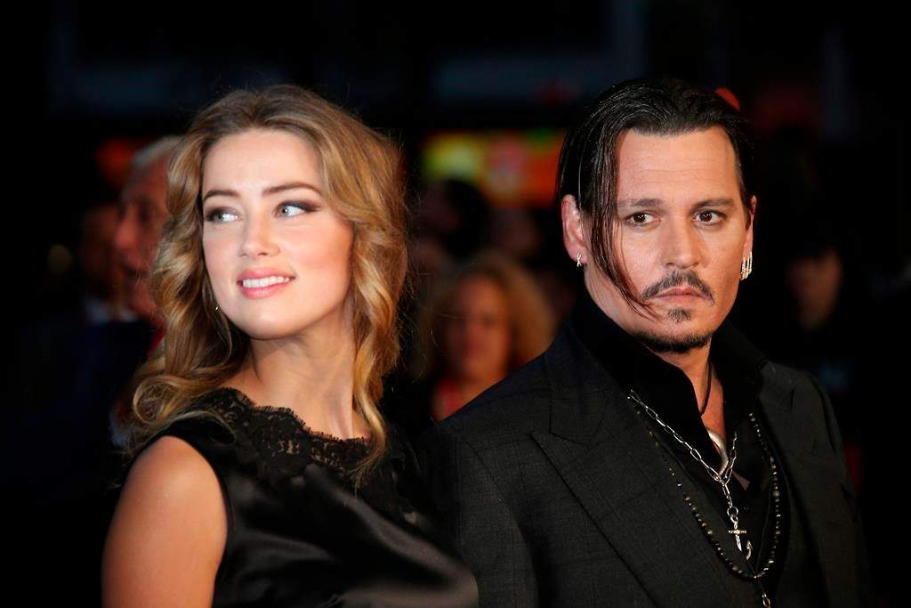 In this Oct. 11, 2015 file photo, Amber Heard, left, and Johnny Depp arrive at the premiere of Depp’s film ‘Black Mass’ at the London film festival.