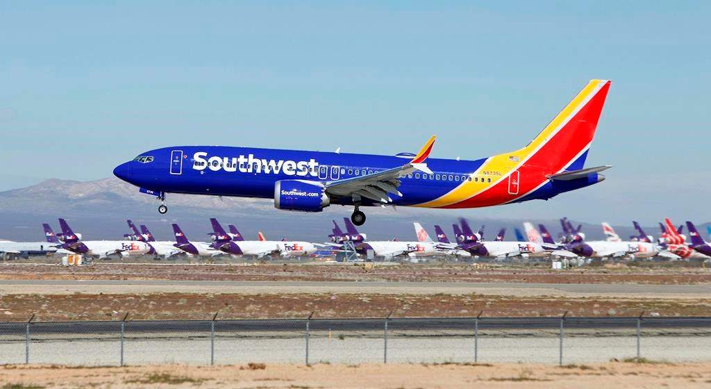 FILE - In this March 23, 2019, file photo, a Southwest Airlines Boeing 737 Max aircraft lands at the Southern California Logistics Airport in the high desert town of Victorville, Calif.