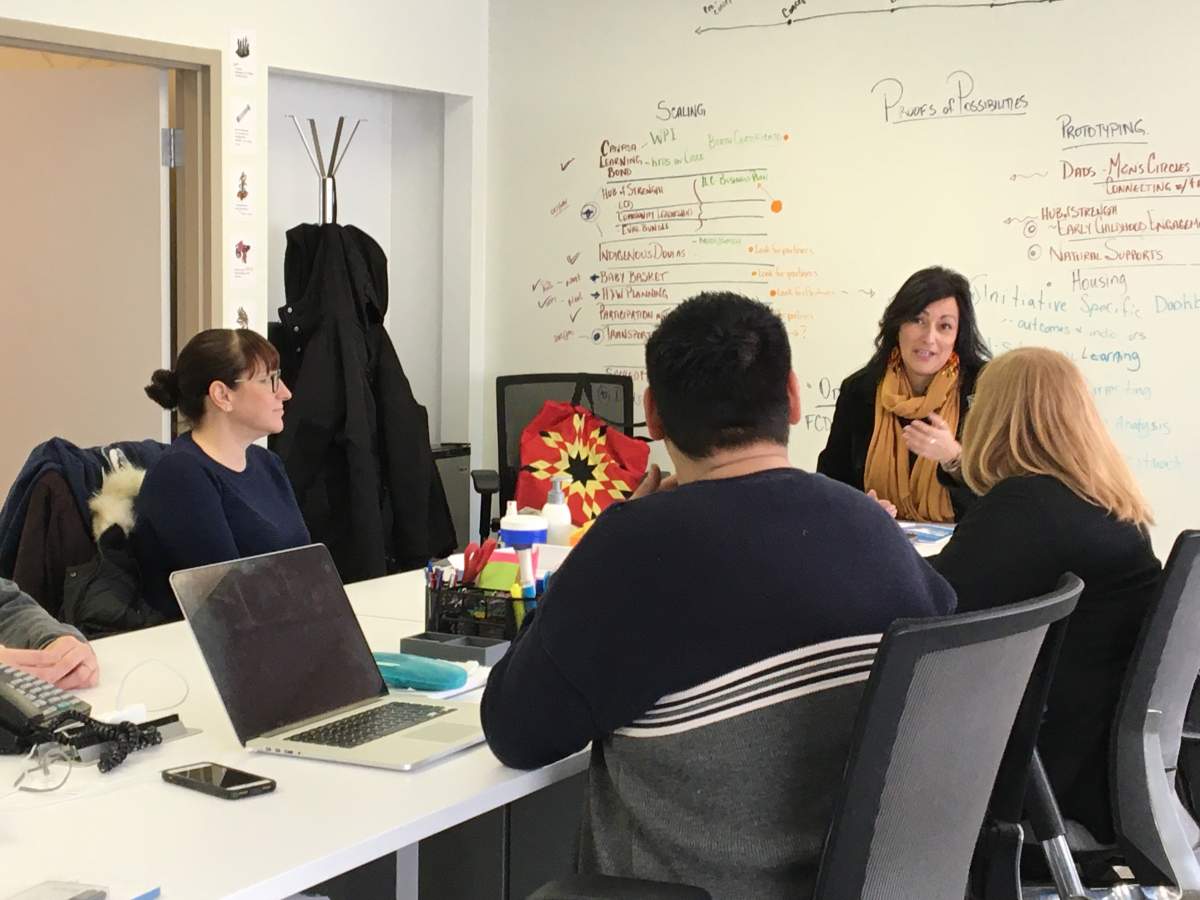 Diane Rousin is seen talking with Winnipeg Boldness members.