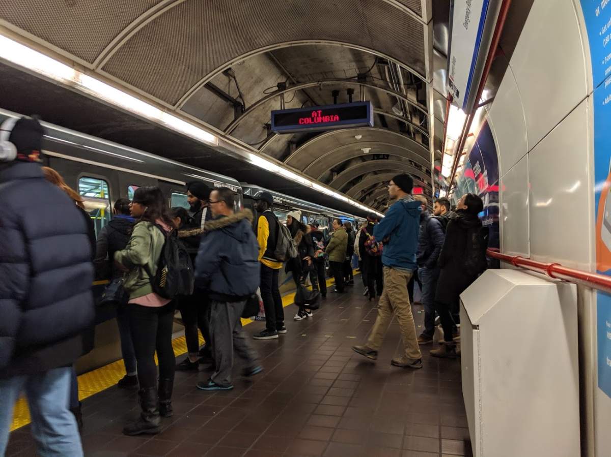 Passengers embark a SkyTrain in Vancouver. 