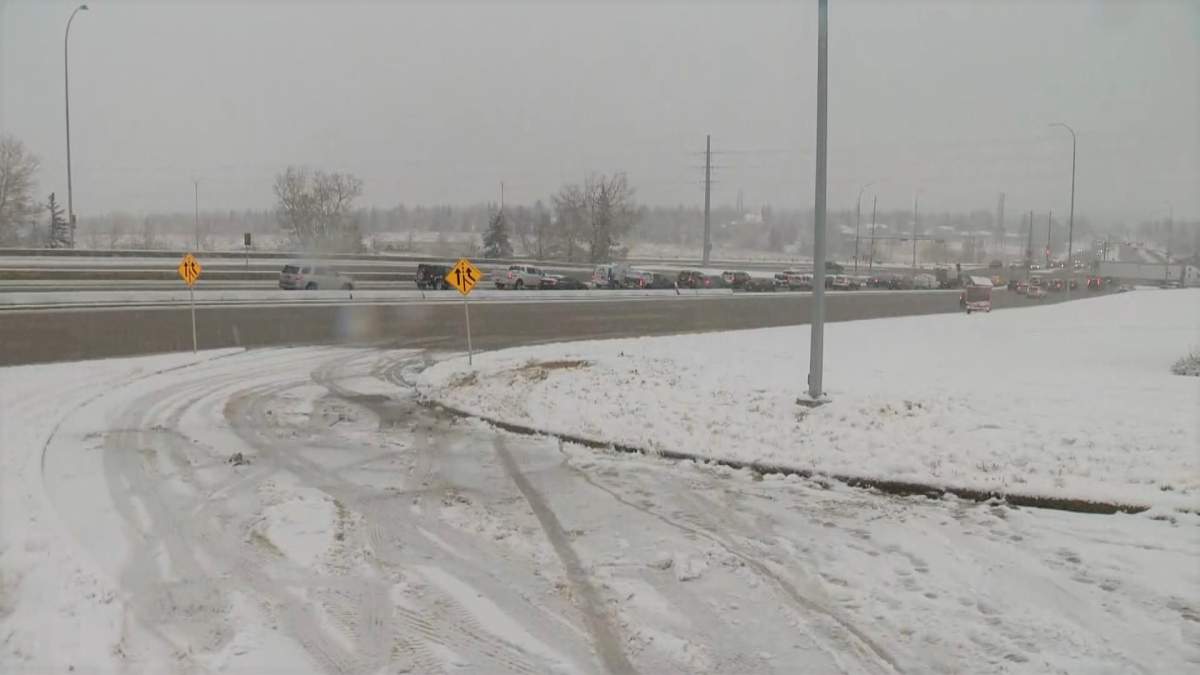 The City of Calgary works to salt and clear snow-covered streets. 