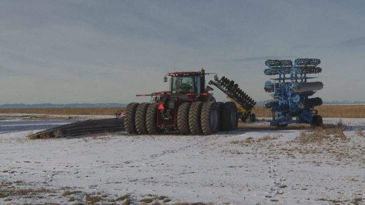 Farming equipment sits in an Alberta farmer's snowy field. Nov. 28, 2019.