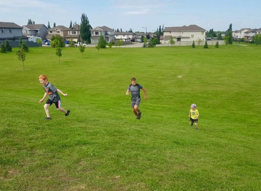 Stephen Schaefer training with his sons ahead of his burpee challenge.