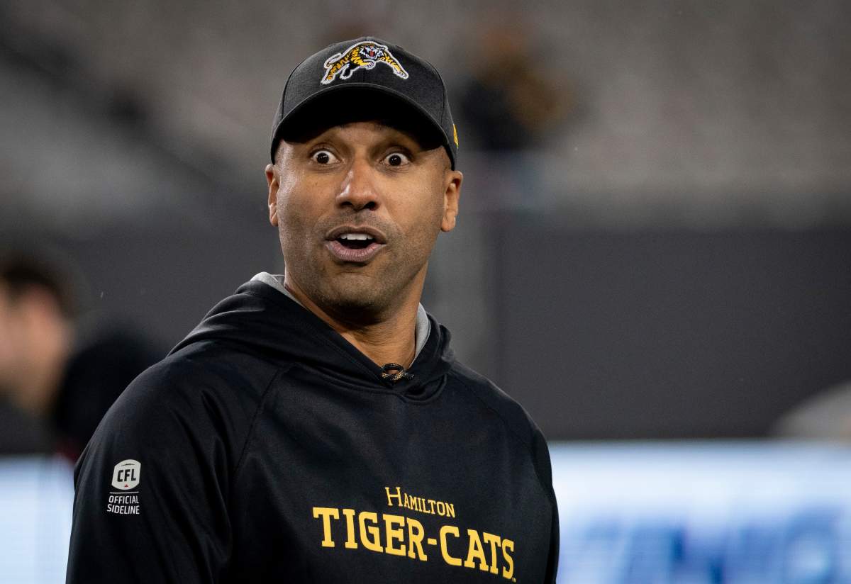 Hamilton Tiger-Cats head coach Orlondo Steinauer fools around during warm-up before CFL football game action against the Toronto Argonauts, in Hamilton, Ont., Saturday, Nov. 2, 2019.