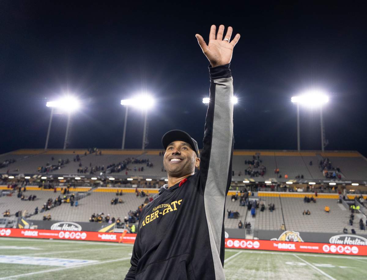 Hamilton Tiger-Cats head coach Orlondo Steinauer waves to people in the crowd following CFL football action against the Toronto Argonauts, in Hamilton, Ont., Saturday, Nov. 2, 2019.