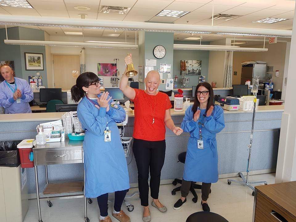 Tina ringing the Bell of Hope after her last radiation treatment.