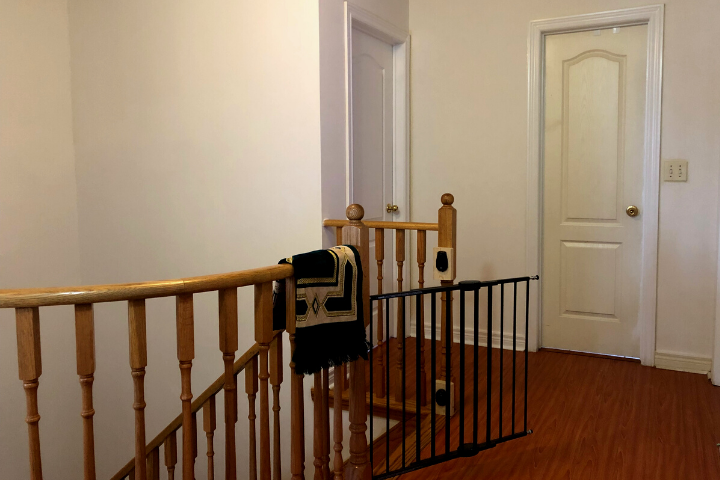 A prayer mat hangs on the railing at Nisa Homes.