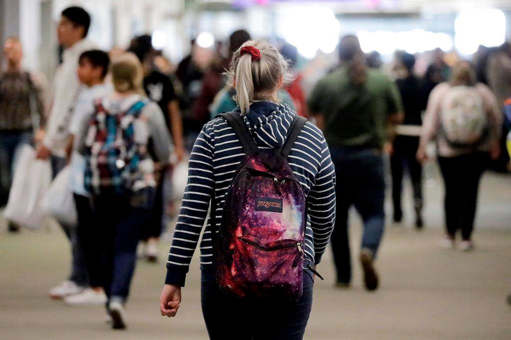 In this Nov. 14, 2019, photo, students walk on the campus of Utah Valley University, in Orem, Utah. (AP Photo/Rick Bowmer).