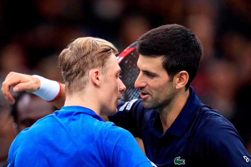 Novak Djokovic of Serbia greets Denis Shapovalov of Canada, left, after winning the final match of the Paris Masters tennis tournament in Paris, Sunday, Nov. 3, 2019. Djokovic defeated Shapovalov of Canada 6-3/6-4.
