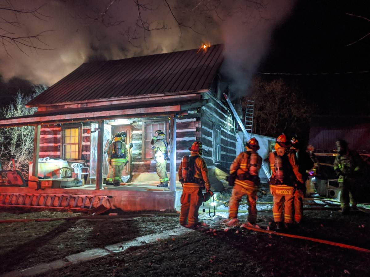 Ottawa firefighters battle a fire at 1717 Cox Country Rd. on Friday night.