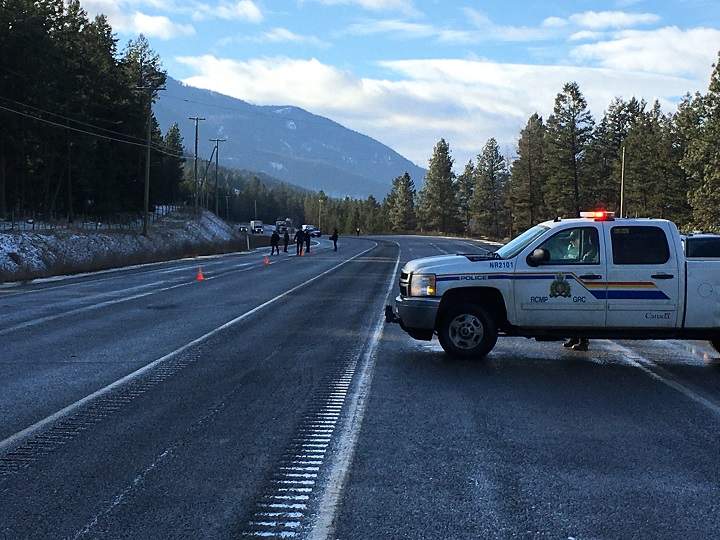 A police vehicle can be seen blocking traffic along Highway 97 near Westwold on Dec. 3, 2019.