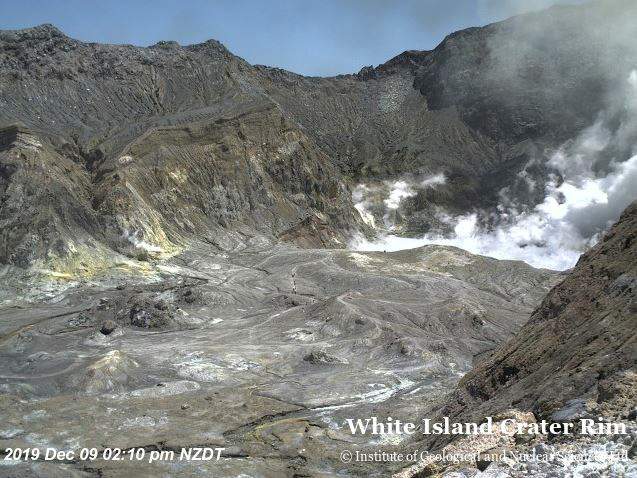 An aerial view shows hikers walking on the crater rim of Whakaari, also known as White Island, shortly before the volcano erupted in New Zealand, on Dec. 9, 2019, in this image obtained via social media.