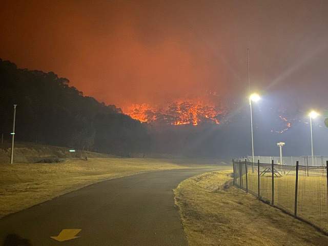 A bushfire burns near the Lithgow Correctional Centre compound in Marrangaroo, New South Wales, Australia on Dec. 19, 2019 in this picture obtained from social media.