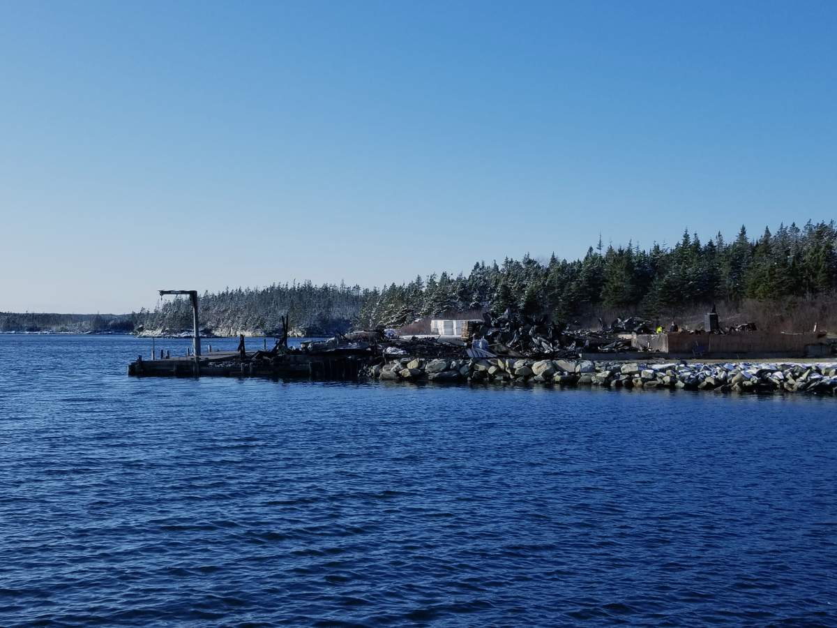 Rubble is all that’s left of Abriel Fisheries in Tangier, N.S. after a devastating fire on Dec. 18, 2019. It’s seen here the following afternoon, as investigators search for clues as to the cause of the blaze.