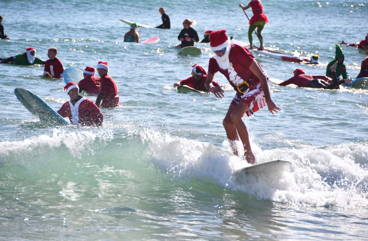 Santas surfing on the Florida Space Coast.
