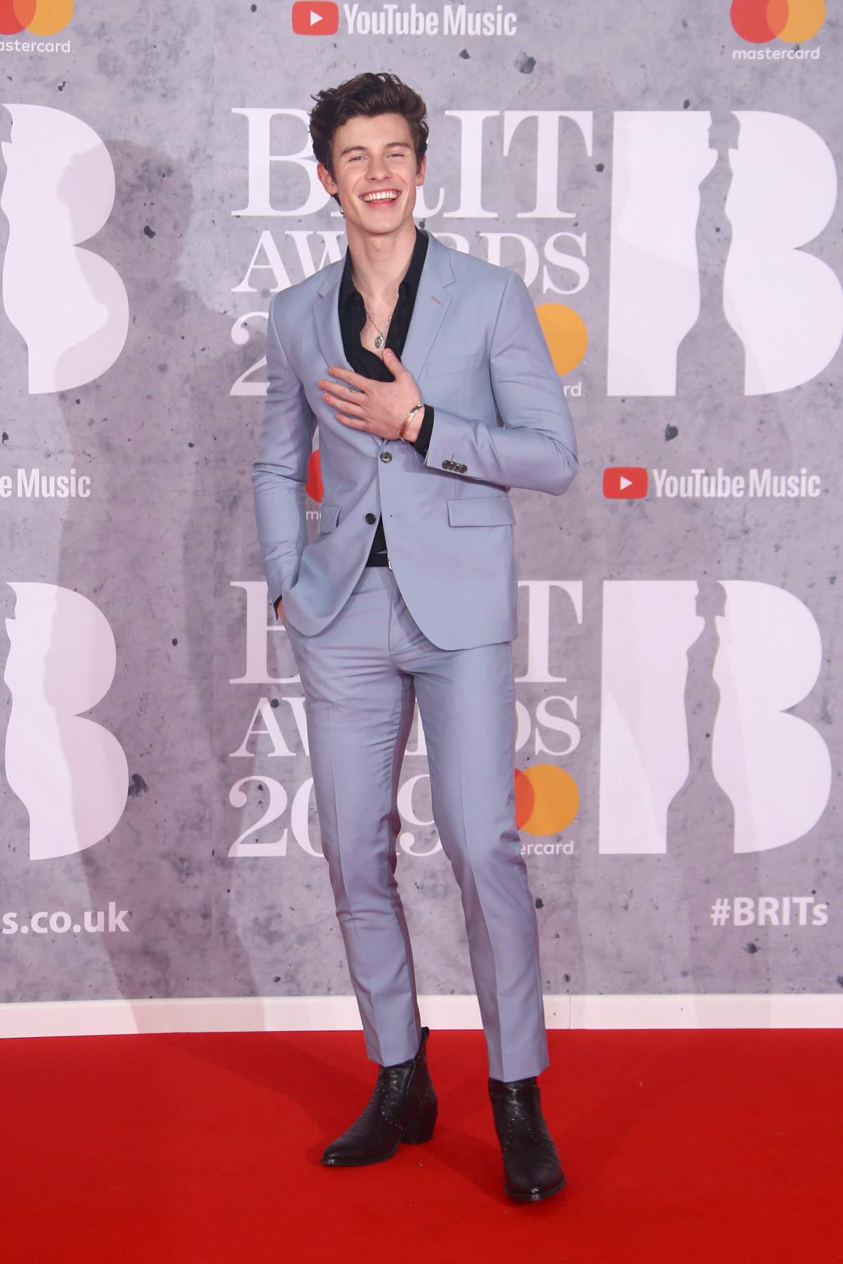 Singer Shawn Mendes posed for photographers upon arrival at the Brit Awards in London on Feb. 20, 2019.