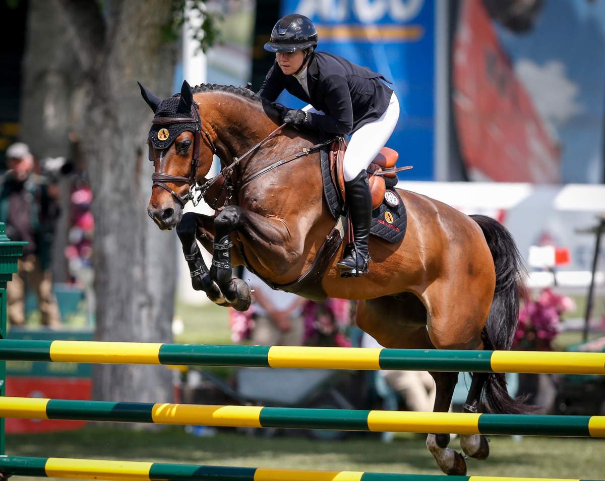 Canada's Nicole Walker rides Falco van Spieveld, during the Grand Prix event of the National at Spruce Meadows in Calgary, Saturday, June 8, 2019. THE CANADIAN PRESS/Jeff McIntosh.