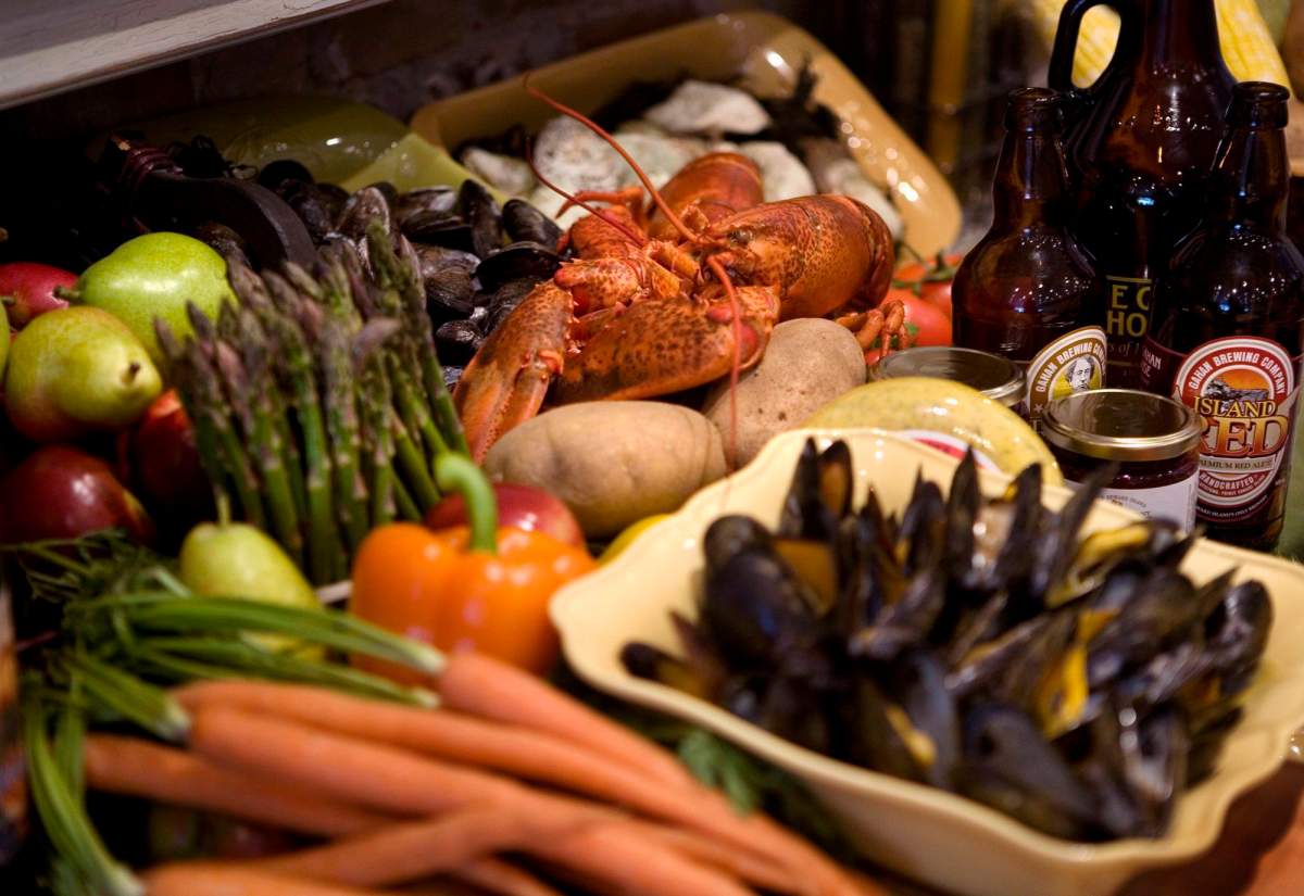 The Maritime provinces have long drawn people seeking beaches and beautiful scenery, but now chefs, brewmasters and tourism operators in the Maritimes are increasing efforts to cultivate and promote food tourism in the region. Chef Michael Smith, not pictured, shows-off a smorgasbord of lobster, mussels, asparagus, and other cherished foods of P.E.I., in Toronto, Wednesday, July 8, 2009,.