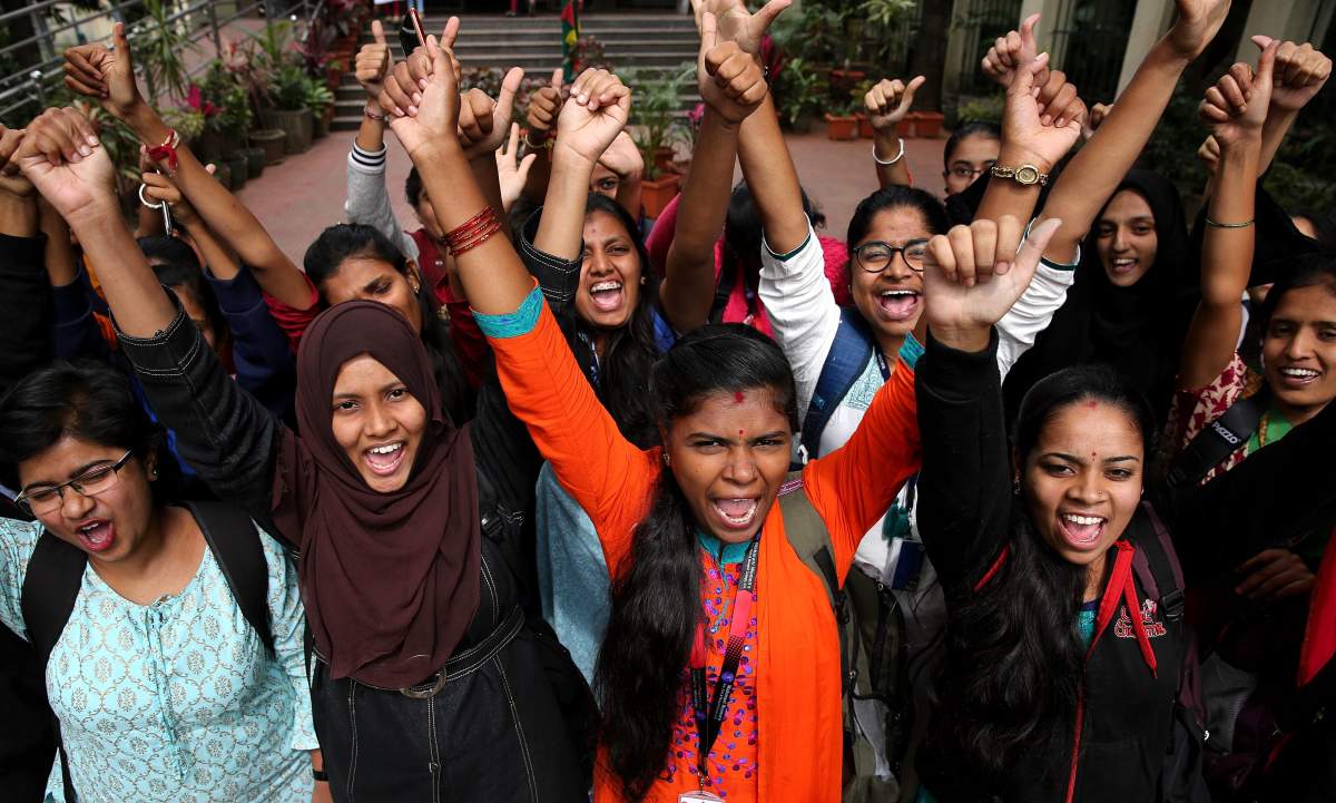 Indian students cheer as they celebrate after all four men accused in the rape and murder of a Hyderabad veterinarian were killed by police officers, in Bangalore, India, 06 December 2019.