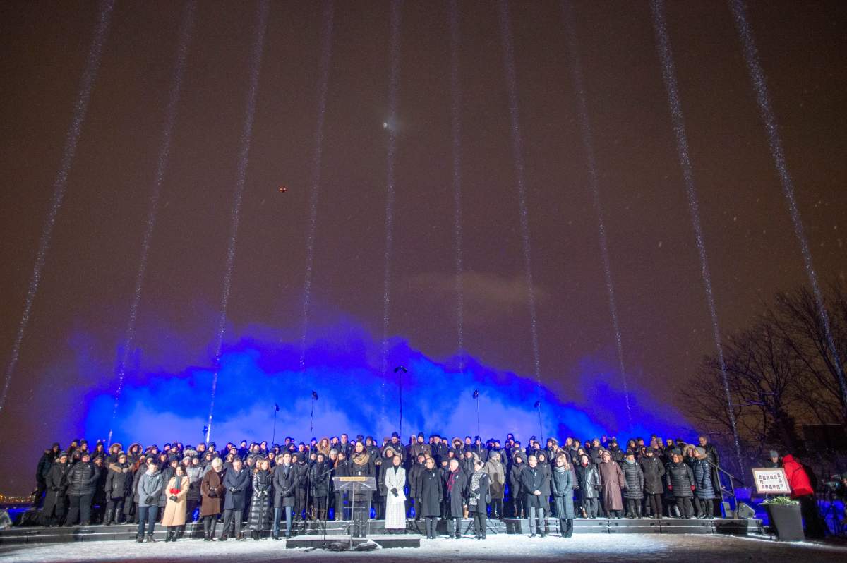Fourteeen beams of light point skyward during ceremonies to mark the 30th anniversary of the 1989 École Polytechnique attack where a lone gunman killed 14 female students, Friday, December 6, 2019 in Montreal.