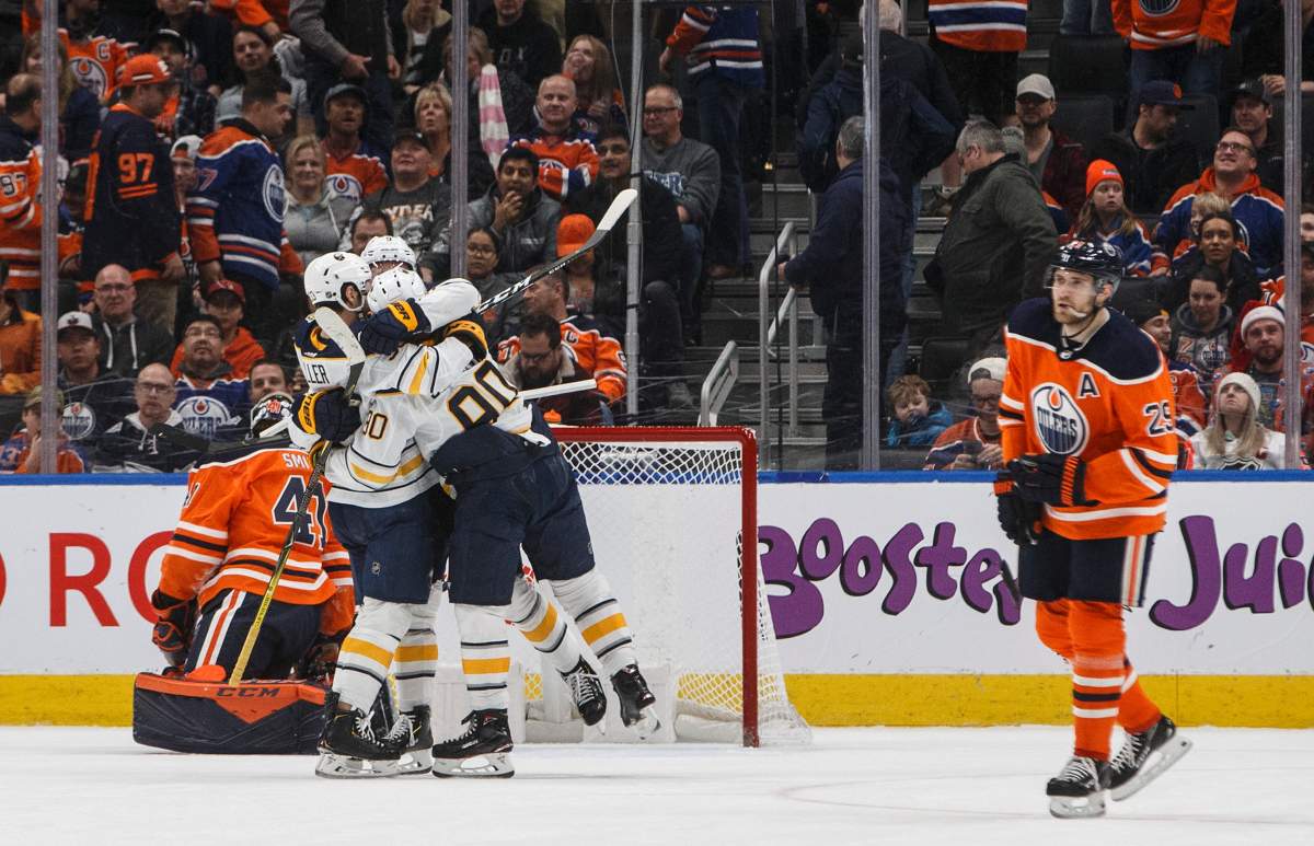 Buffalo Sabres players celebrate the overtime goal against the Edmonton Oilers during NHL action in Edmonton, Alta., on Sunday December 8, 2019. THE CANADIAN PRESS/Jason Franson.