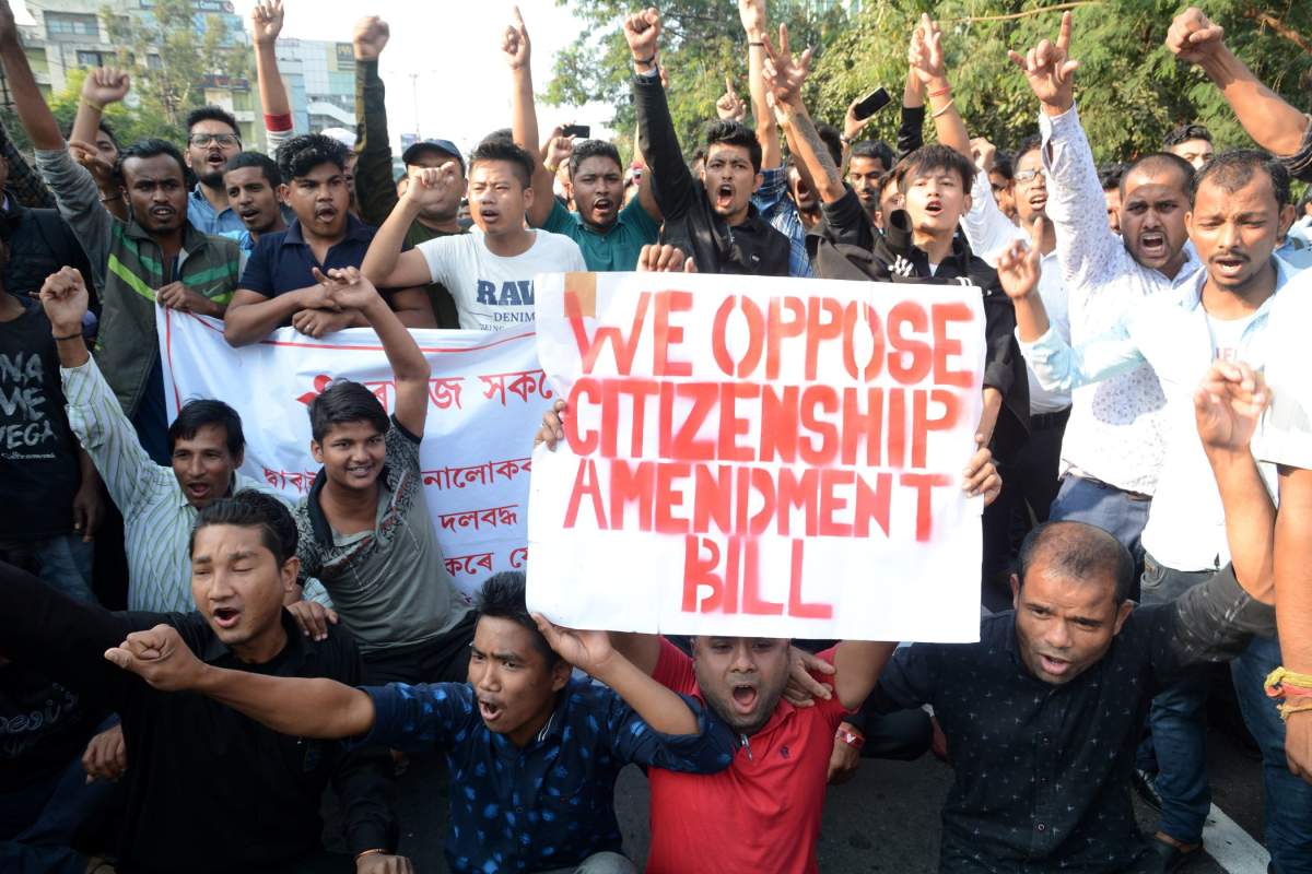 Students hold a sign in protest of the Citizenship Amendment Bill in Guwahati, Assam, India, Dec. 11, 2019.