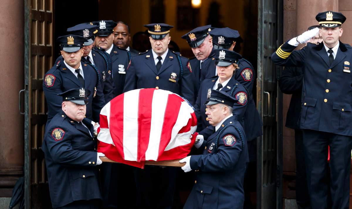 Pallbearers carry the casket of Jersey City Police Detective Joseph Seals, who was killed in an incident connected to the shooting on 10 December at a kosher grocery, to a hearse following his funeral at St. Aedan’s church in Jersey City, NJ., Dec. 17, 2019.
