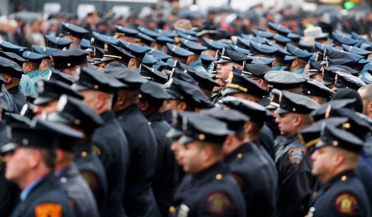 Police officers from across the country gather for a funeral service for Jersey City Police Detective Joseph Seals, who was killed in an incident connected to the shooting on 10 December at a kosher grocery, at St Aedan’s church in Jersey City, NJ., Dec. 17, 2019.